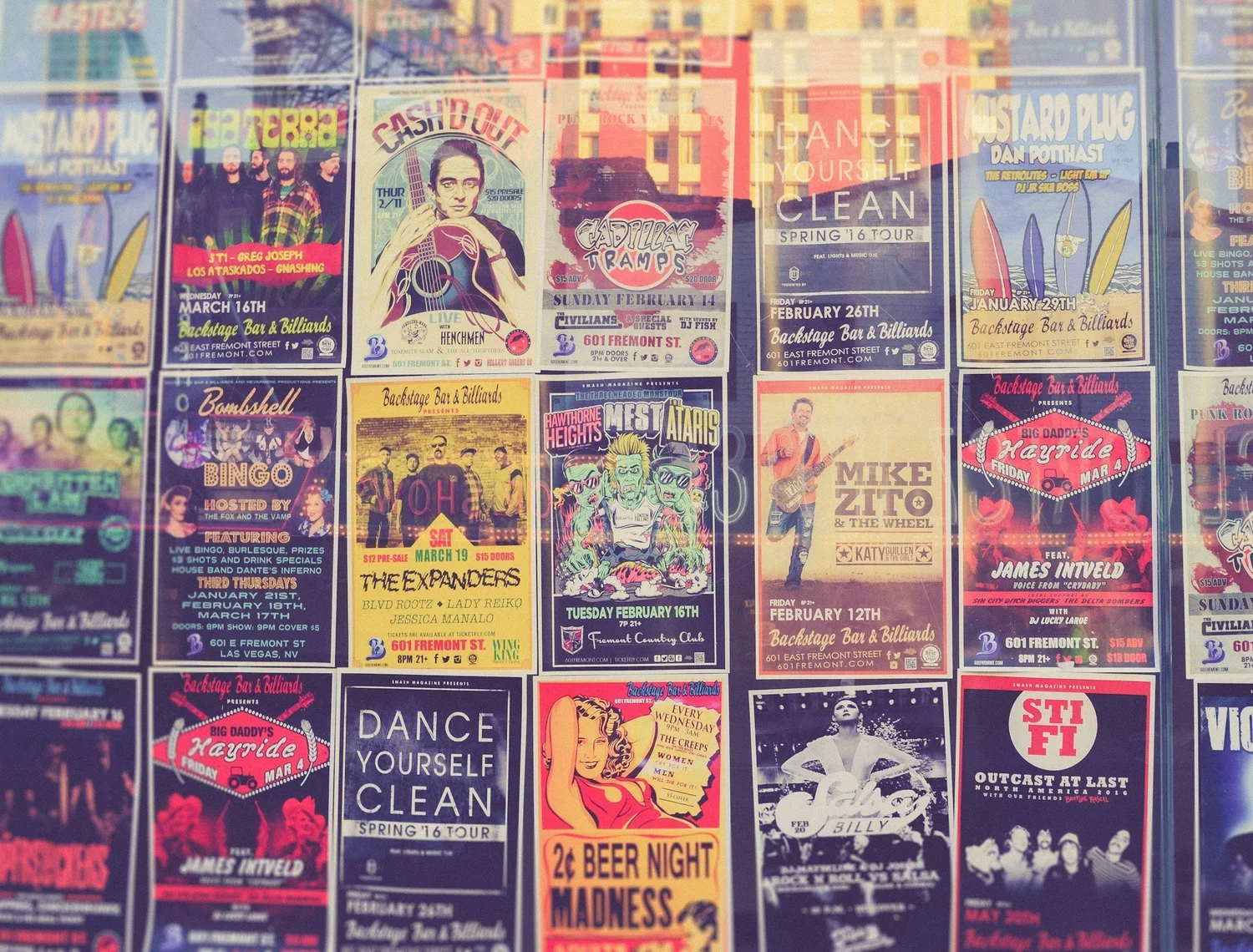 Wall of printed gig posters